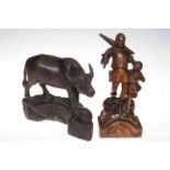 Carved wood buffalo and figure carving of man and child with crossbow (2).
