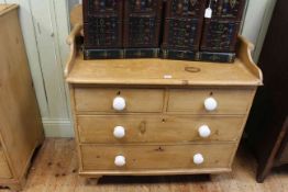 Pine shaped gallery back chest of two short above two long drawers, 106cm by 98cm.