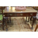 Late 19th/early 20th Century mahogany three drawer side table to paw feet, 77cm by 107cm.