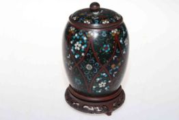 Antique cloisonne tea canister and carved wood stand.