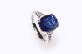 Fine cushion Ceylon sapphire and diamond ring set in platinum,