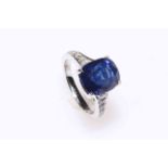 Fine cushion Ceylon sapphire and diamond ring set in platinum,