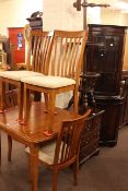 Extending dining table and four chairs, mahogany display cabinet,