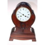 Edwardian mahogany balloon mantel clock raised on four bracket feet, 34cm.