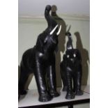 Pair of leather elephants (Liberty style), 74cm and 52cm.