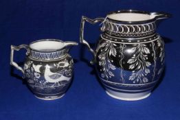 Two early 19th Century silver resist jugs, 16cm and 11cm.