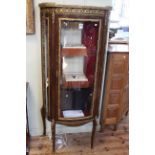 Continental ormolu mounted bow front vitrine, 149.5cm by 67cm.