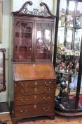 Georgian style mahogany bureau bookcase having fretwork swan neck pediment and two glazed panel