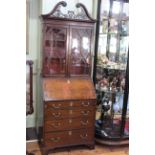 Georgian style mahogany bureau bookcase having fretwork swan neck pediment and two glazed panel