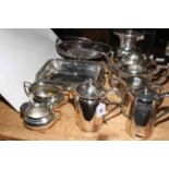Collection of silver plated teapots, jug, basket, trays.