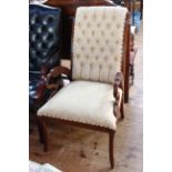 Occasional chair with swan carved arms in cream buttoned fabric.