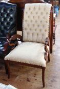 Occasional chair with swan carved arms in cream buttoned fabric.