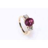 Fine pink sapphire and diamond three-stone ring set in 18 carat gold,