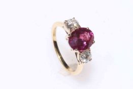 Fine pink sapphire and diamond three-stone ring set in 18 carat gold,