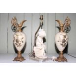 Pair of gilt metal and opaque glass ewers together with a cherub table lamp, 48cm and 49cm.