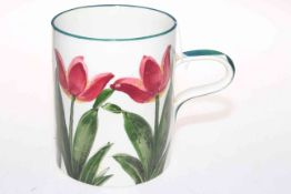 Wemyss ware mug decorated with tulips, 14cm high.