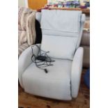 Fama reclining swivel armchair in pale blue fabric.