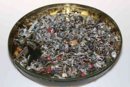 Tin of over one hundred lead soldiers.