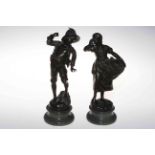 Pair bronzes of playful boy and girl, on marble bases and signed Mayer, 27cm.