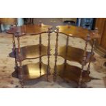 Pair Victorian style three tier etagés, the shaped shelves supported by turned pillars,