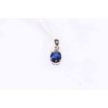 Sapphire and diamond pendant set in 18 carat white gold.