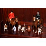 Beswick Huntsman, Huntswoman, four dogs and seated fox (7).