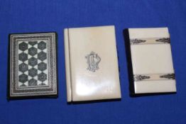 Two Victorian ivory aide de memoires and needle case (3).