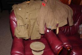 Two military jackets and hat.