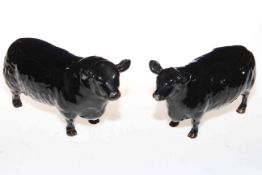 Beswick Aberdeen Angus bull and cow, 1562 and 1563.