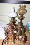 Oil lamps, shades, copper kettle, bell, goblet, Guernsey de la Rue copper milk pot, candlesticks.