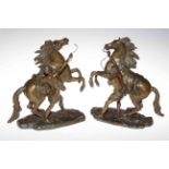 Pair of bronzed models of Marley horses.