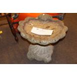 Weathered shell pedestal bird bath.