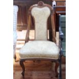 Victorian walnut framed occasional chair in pale yellow fabric.