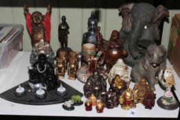 Collection of Buddha's, elephants, fengshui fu dogs.