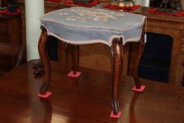 Cabriole leg stool of serpentine form with needlework seat.