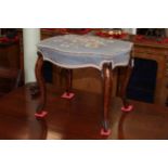 Cabriole leg stool of serpentine form with needlework seat.