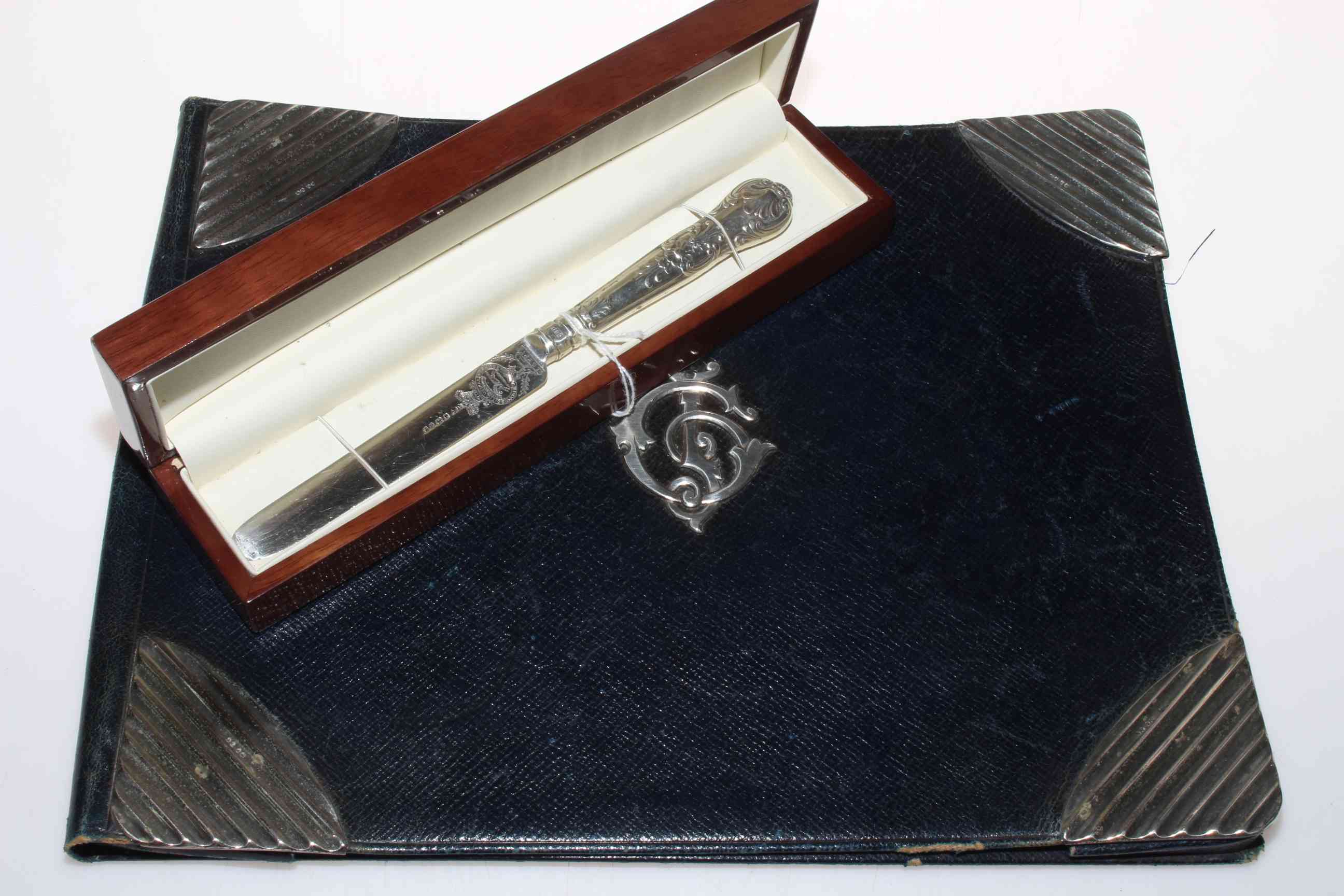 Silver mounted blotter and boxed silver regimental knife (2).