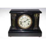 Ebonised slate effect mantel clock with enamel dial.