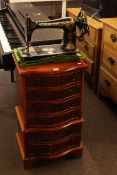 Neat serpentine front six drawer chest and antique Singer hand sewing machine (2).