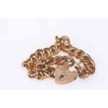 9 carat gold chain link bracelet with padlock fastener.