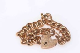 9 carat gold chain link bracelet with padlock fastener.