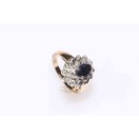 Oval sapphire and multi-stone diamond cluster ring set in 9 carat gold, size O.