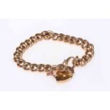 15 carat gold chain link bracelet with gold plated padlock fastener.