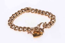 15 carat gold chain link bracelet with gold plated padlock fastener.