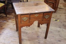 Georgian oak three drawer lowboy raised on square moulded legs, 69.5cm by 67cm.