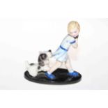 Goldscheider figure of girl playing with dog, impressed No. 6853, 16cm high.