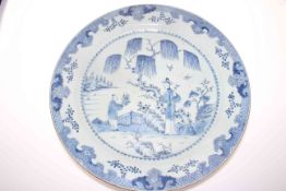 19th Century Chinese blue and white plaque decorated with figures in landscape bearing twin stamps