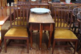 Georgian mahogany gate leg dining table on pad feet together with six Georgian mahogany rail back