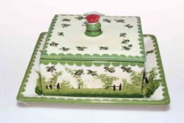 Wemyss ware butter dish and stand decorated with bees.