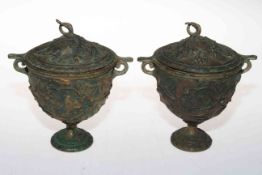 Pair antique metal urns and covers with relief vine decoration, 16cm.